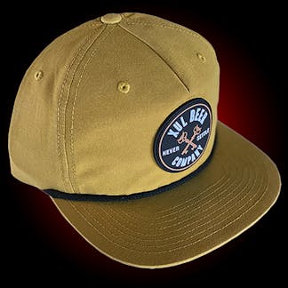 Yellow grandpa hat with a black cord. It has a round rubber patch with our circle logo.