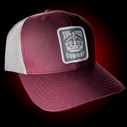 Maroon trucker hat with our crown logo on a gray patch. Side view