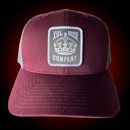 Maroon trucker hat with our crown logo on a gray patch. Front view