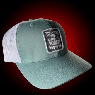 Seafoam trucker hat with our crown logo on a gray patch. Side view