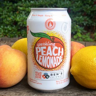 can of peach lemonade with fruit