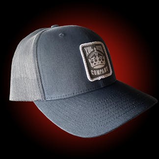 Navy trucker hat with our crown logo on a gray patch