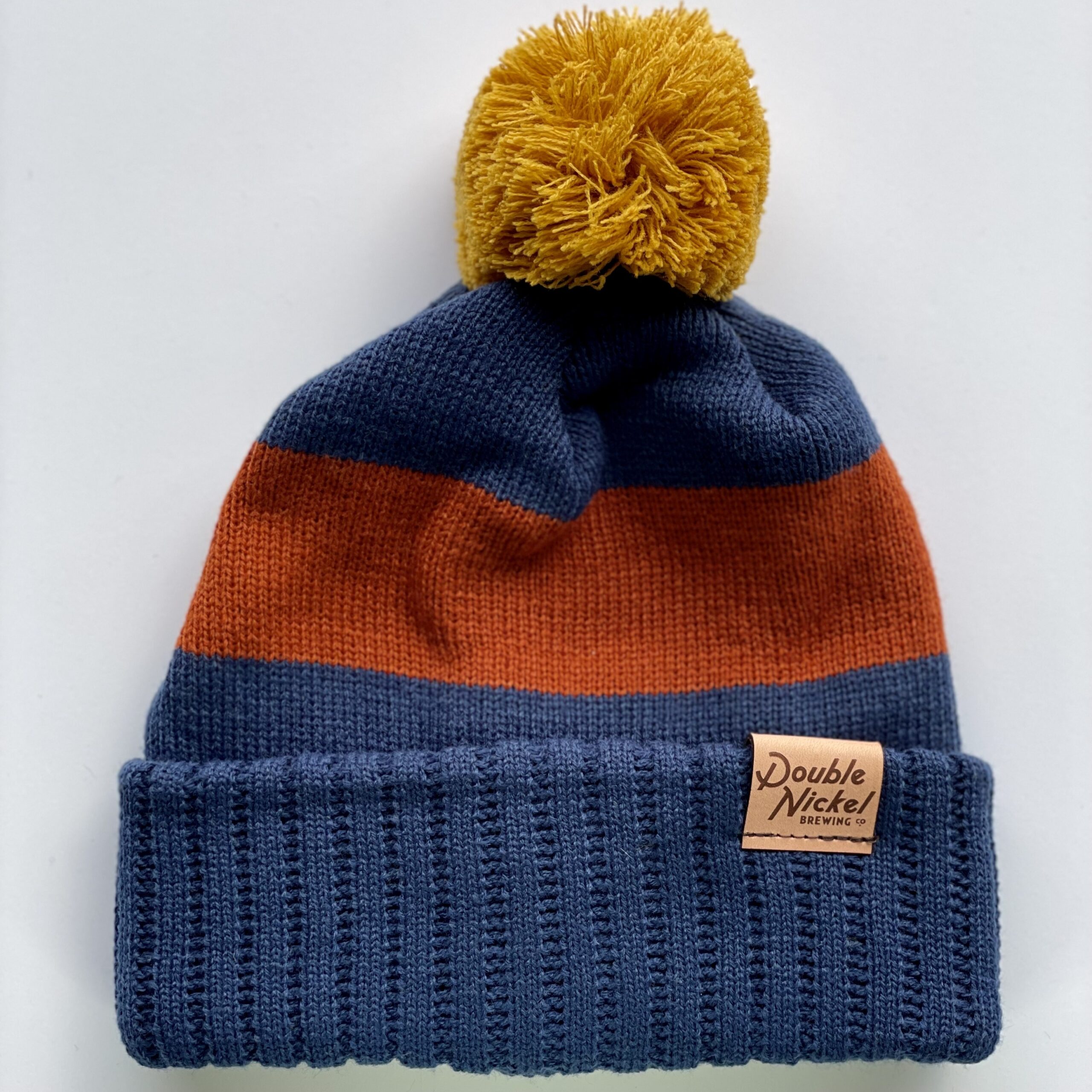 Beanie W Pom Pom Navy Orange Gold Double Nickel Brewing Co Online   Navy Pom Pom Beanie Scaled 