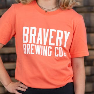 orange t-shirt with "Bravery Brewing Co." written in white letters
