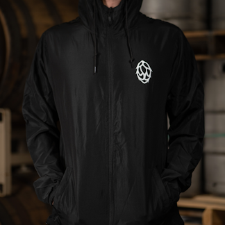Black windbreaker jacket with drawing of a hop flower in white on left side of chest