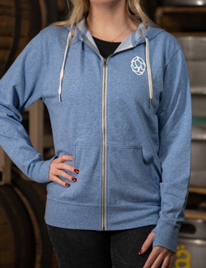 light blue zip-up hoodie with white hop on the front left side