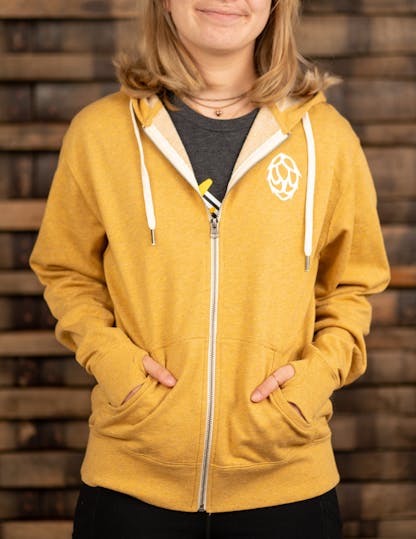 yellow zip-up hoodie with white hop on the front left side