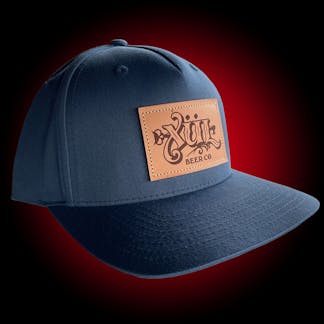 navy hat with our classic logo on a brown leather patch