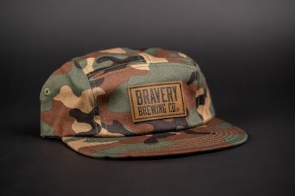 Brown and green camouflage hat with lather Bravery Brewing patch