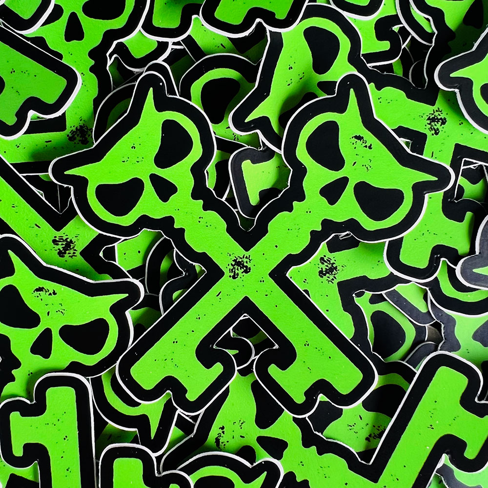 stack of green crosskeys stickers