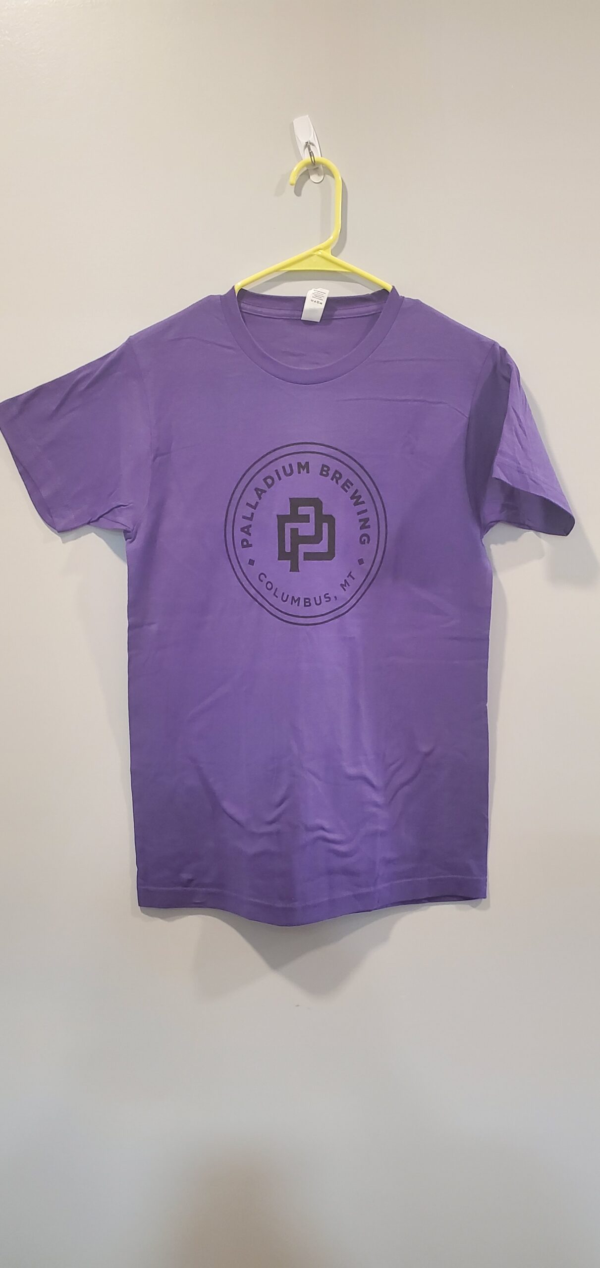 Purple t-shirt with Palladium Brewing badge logo.