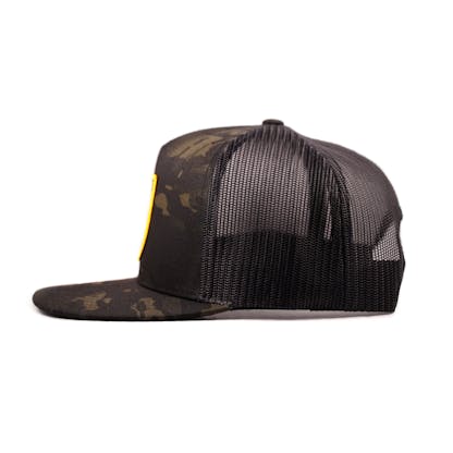 Black camouflage hat with mesh back and shield logo on front in side view