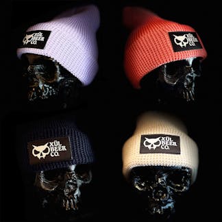 4 different colors of waffle beanies on skull heads
