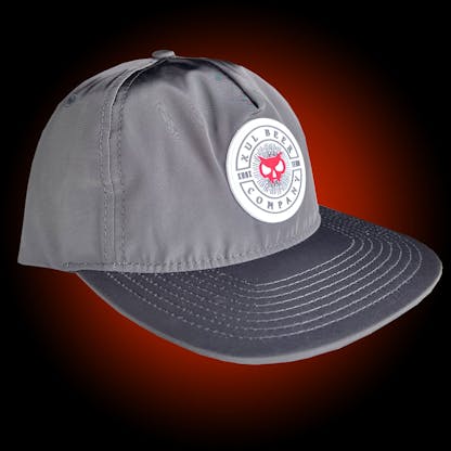 black shimmer 5-panel hat with our logo on a white rubber patch