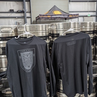 long sleeve black shirt with shield logo on front and nameplate logo on back
