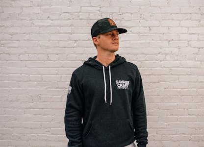 Black hoodie sweatshirt with small white Savage Craft logo on front left