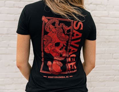 Women's fitted t-shirt with large red Savage Craft logo on the back