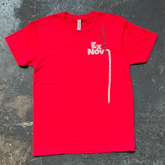 red t-shirt on concrete floor with white and black logo text "Ex Novo"