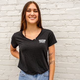 Women's black short sleeve v-neck shirt with small Savage Craft logo on top left front