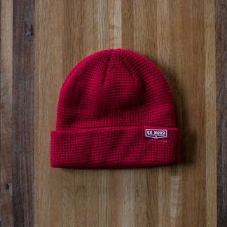 red waffle knit beanie with clip tag with text "Ex Novo Brewing Company"