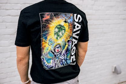 Black short sleeve T-shirt with large colorful Savage Craft logo on the back