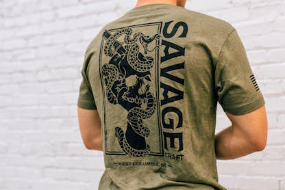 Green short sleeve T-shirt with large black Savage Craft logo on the back