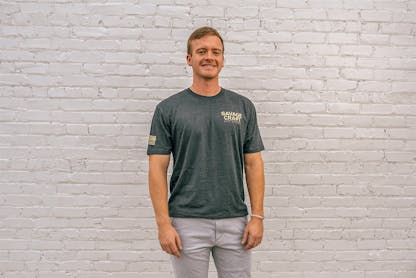 Gray short sleeve T-shirt with "Savage Craft" small logo on front left in gold lettering