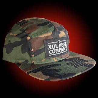 5 panel camo hat with white logo on black woven patch