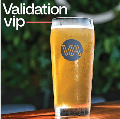 Validation VIP logo with tall beer in the background