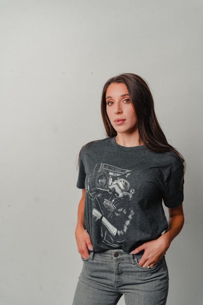 woman wearing charcoal shirt with mural