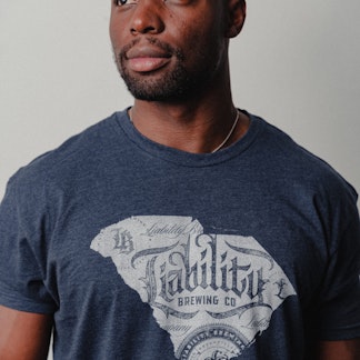 man wearing navy shirt with SC state logo