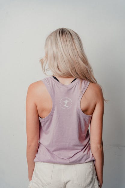 woman wearing a lavender tank top with Liability Brewing