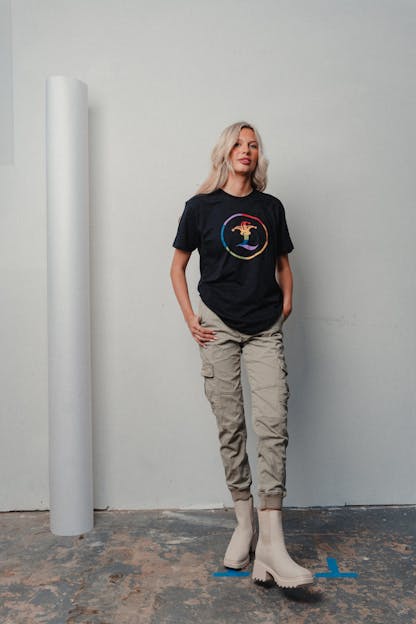 woman wearing black shirt with rainbow jester L