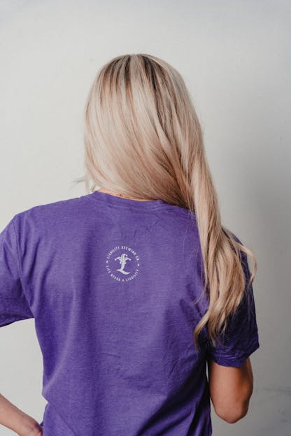 woman wearing purple shirt with SC state logo