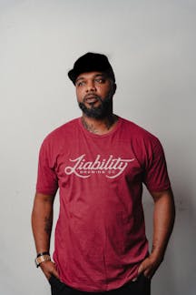 man wearing a cardinal shirt with Liability Brewing