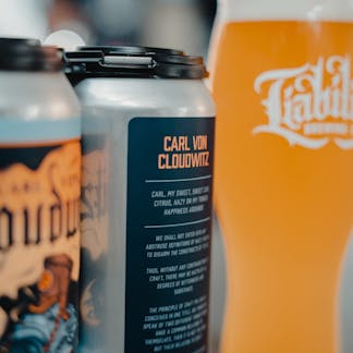 cans of beer and draft in taproom