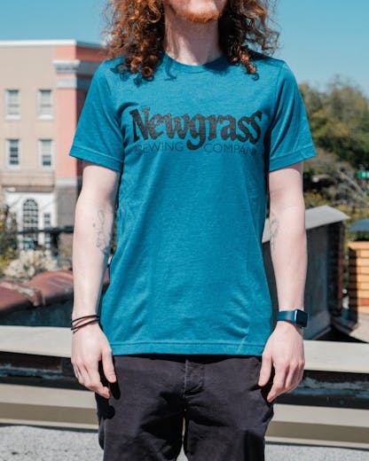 Teal short sleeve t-shirt with large Newgrass Brewing logo in black