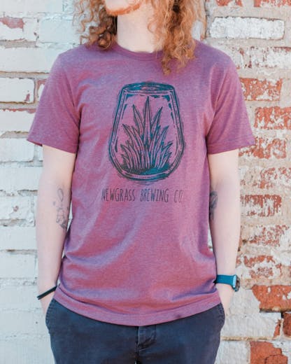 Heathered red short sleeve t-shirt with large Newgrass Brewing terrarium logo in black