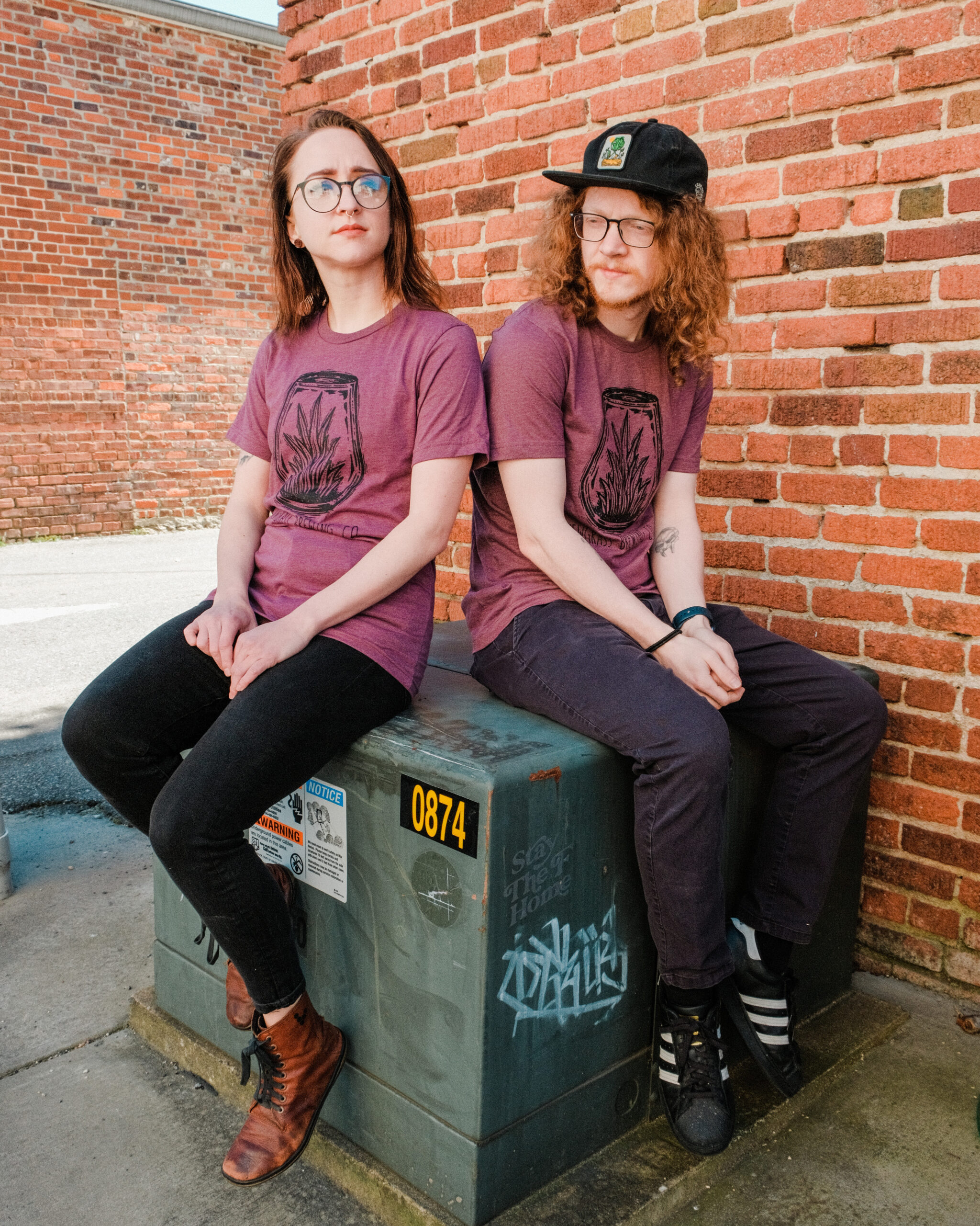 Heathered red short sleeve t-shirt with large Newgrass Brewing logo in black