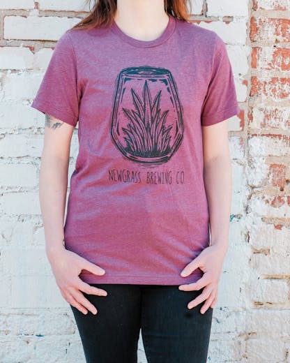 Heathered red short sleeve t-shirt with large Newgrass Brewing terrarium logo in black