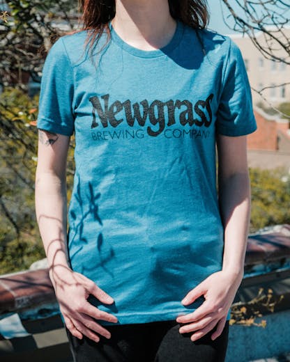 Teal short sleeve t-shirt with large Newgrass Brewing logo in black