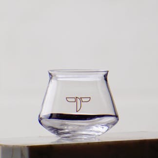 Mini tasting glass with a teagle logo printed on center.