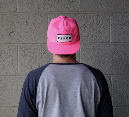 Neon Pink hat with FERDA patch on center of hat.