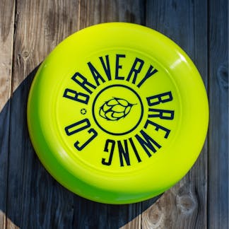neon yellow Bravery Brewing frisbee