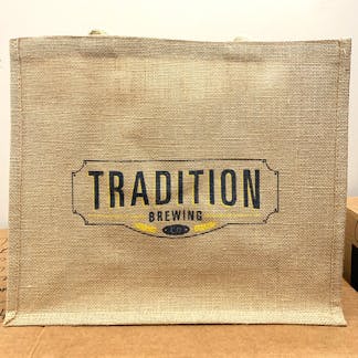 Large burlap tote bad with shield logo.