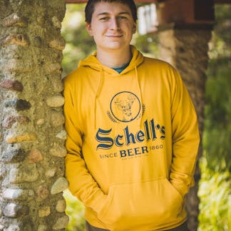 A man wearing a sweatshirt that says  schells