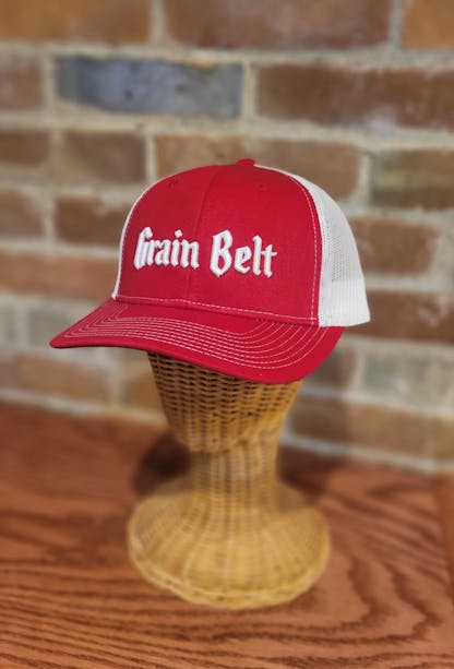 Red and white hat with the words 