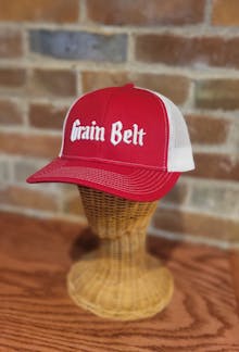 Red and white hat with the words 