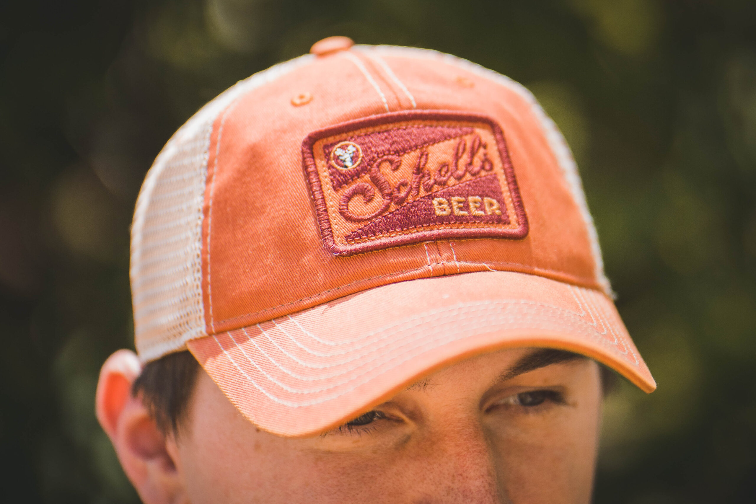 Orange and white hat says scaled