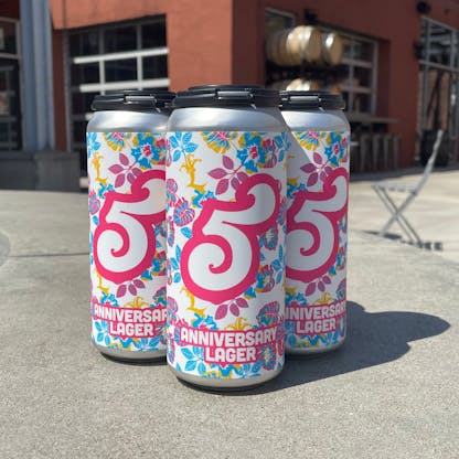 anniversary no 5 lager cans on patio